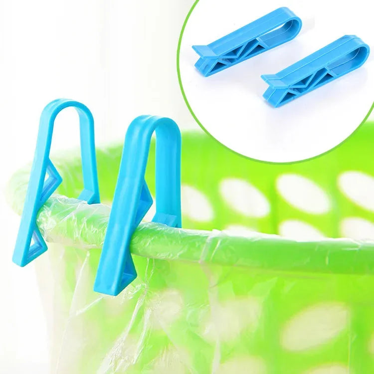 Blue plastic clips used to hold garbage bags or snack bags on a trash can or basket.