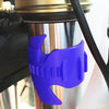 A purple motorcycle fork seal cleaning tool is shown inserted into a shock absorber cylinder.