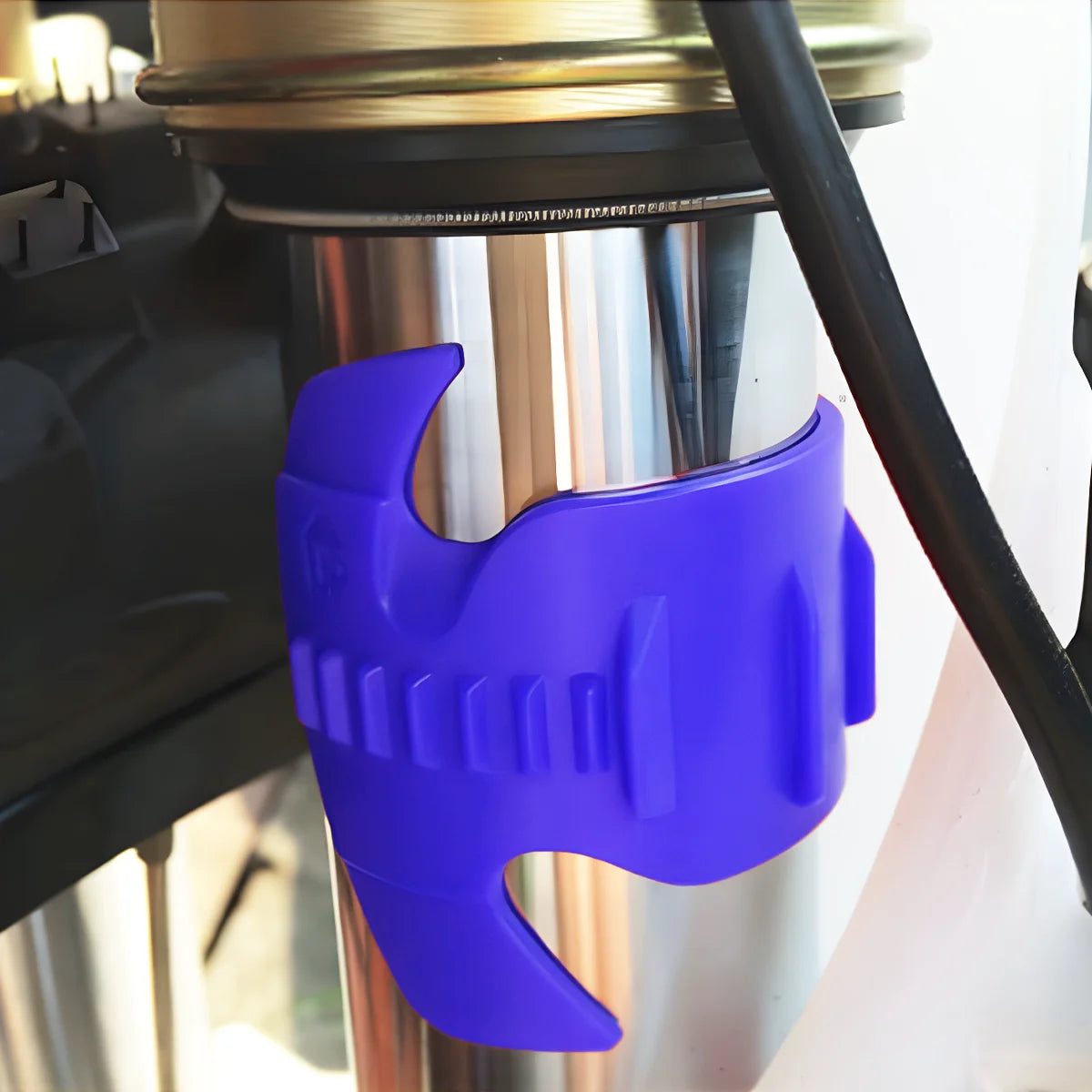 A purple motorcycle fork seal cleaning tool is shown inserted into a shock absorber cylinder.