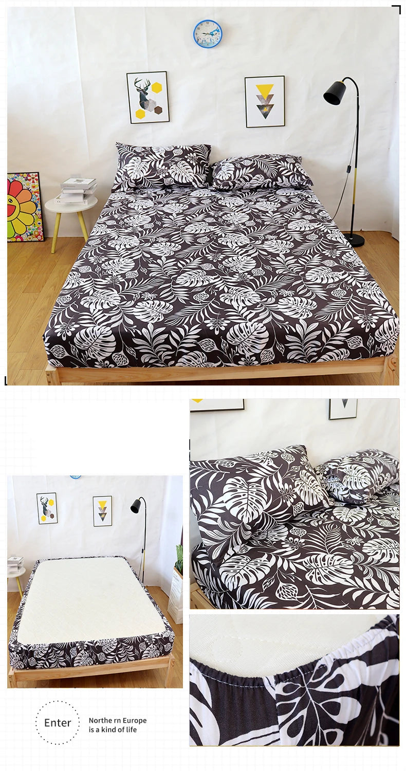 A fitted bed sheet featuring a marbled print with leaves and flowers in black and white on a wooden bed frame.