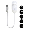 A white 2-in-1 mini projector night light with a USB connector and multiple light patterns displayed on the side.