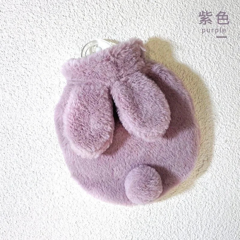 A soft purple plush rabbit hot water bottle with a flannel cover.
