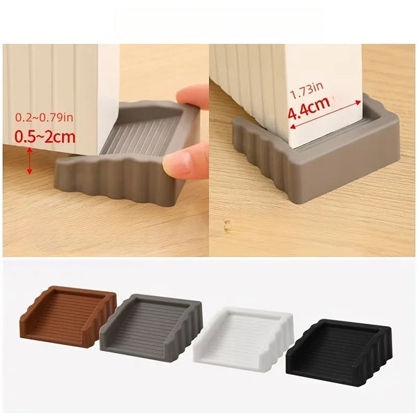 A set of reusable TPR door stop wedges in various colors and sizes, shown next to a white block for scale.