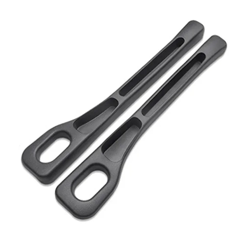 A pair of black universal car seat gap filler and storage organizer tools.
