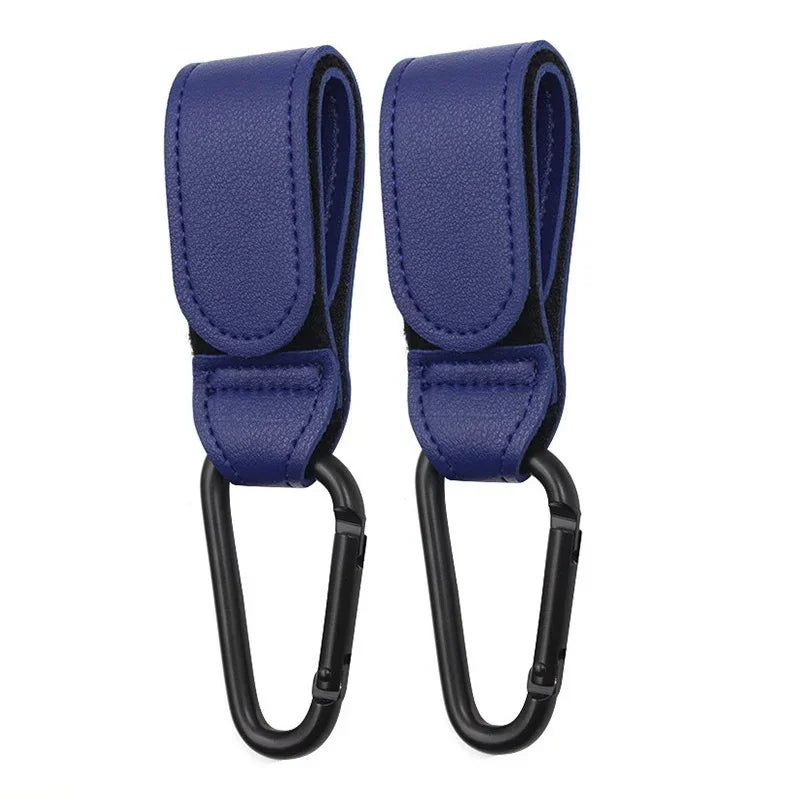 A pair of navy blue PU leather stroller hooks with black straps and loops.
