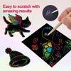 A hand uses a wooden stylus to scratch colorful designs onto black paper, demonstrating easy results.