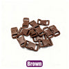 A pile of brown plastic side-release buckles for paracord bracelet projects.