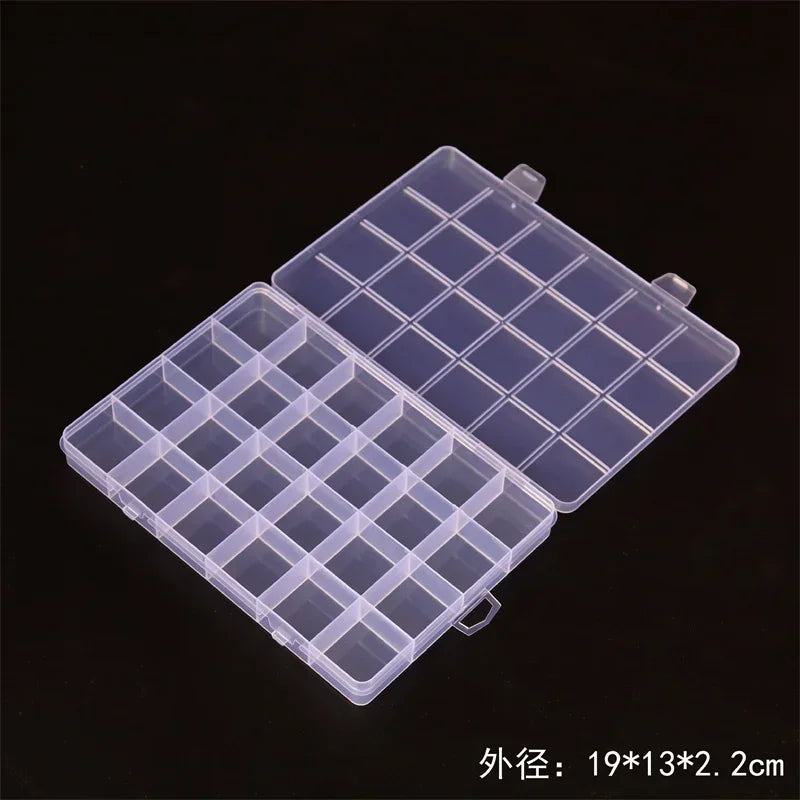 Transparent multi-compartment storage box with fixed dividers, shown open on a dark background.