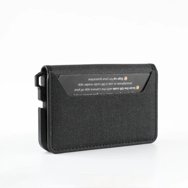 A black minimalist leather card holder with a transparent display featuring a QR code scanner.