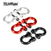 A set of two metal alloy tow shackles for an RC crawler, shown in silver and red colors.