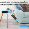 A blue silicone remote cover protects a Fire TV Stick from drops on a sofa or table.