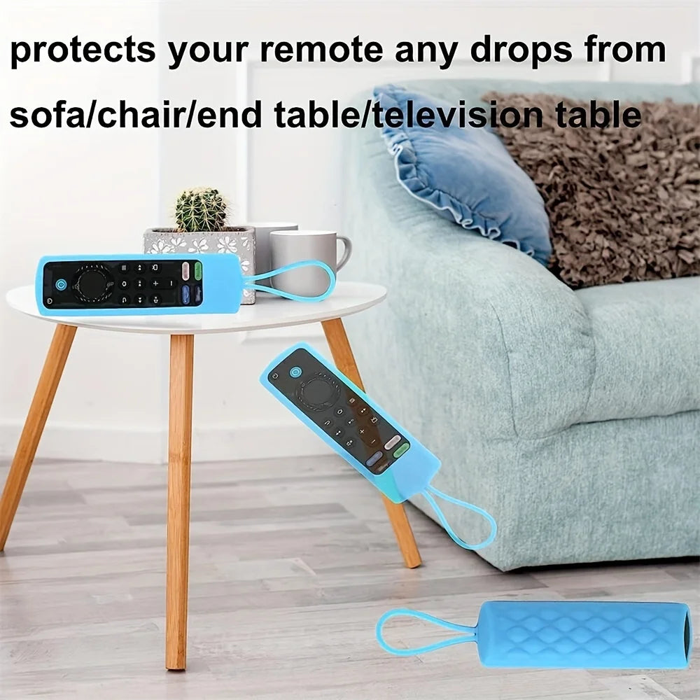 A blue silicone remote cover protects a Fire TV Stick from drops on a sofa or table.