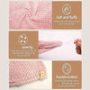 Pink microfiber hair drying towel wrap featuring a waffle weave fabric and a double button closure.