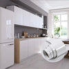 A roll of white marble wallpaper is displayed on a kitchen cabinet counter in a modern room.