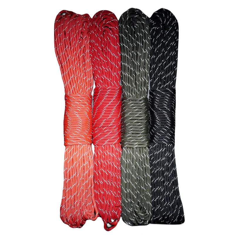 Four strands of reflective paracord rope in red, green, and black colors.