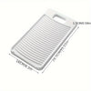 White non-slip laundry scrubbing board with a handle and ribbed surface.