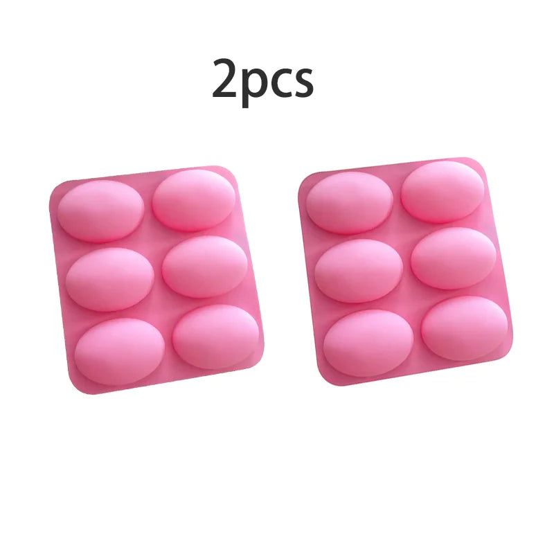 Two pink silicone molds with six cavities each for soap, baking, and DIY crafts