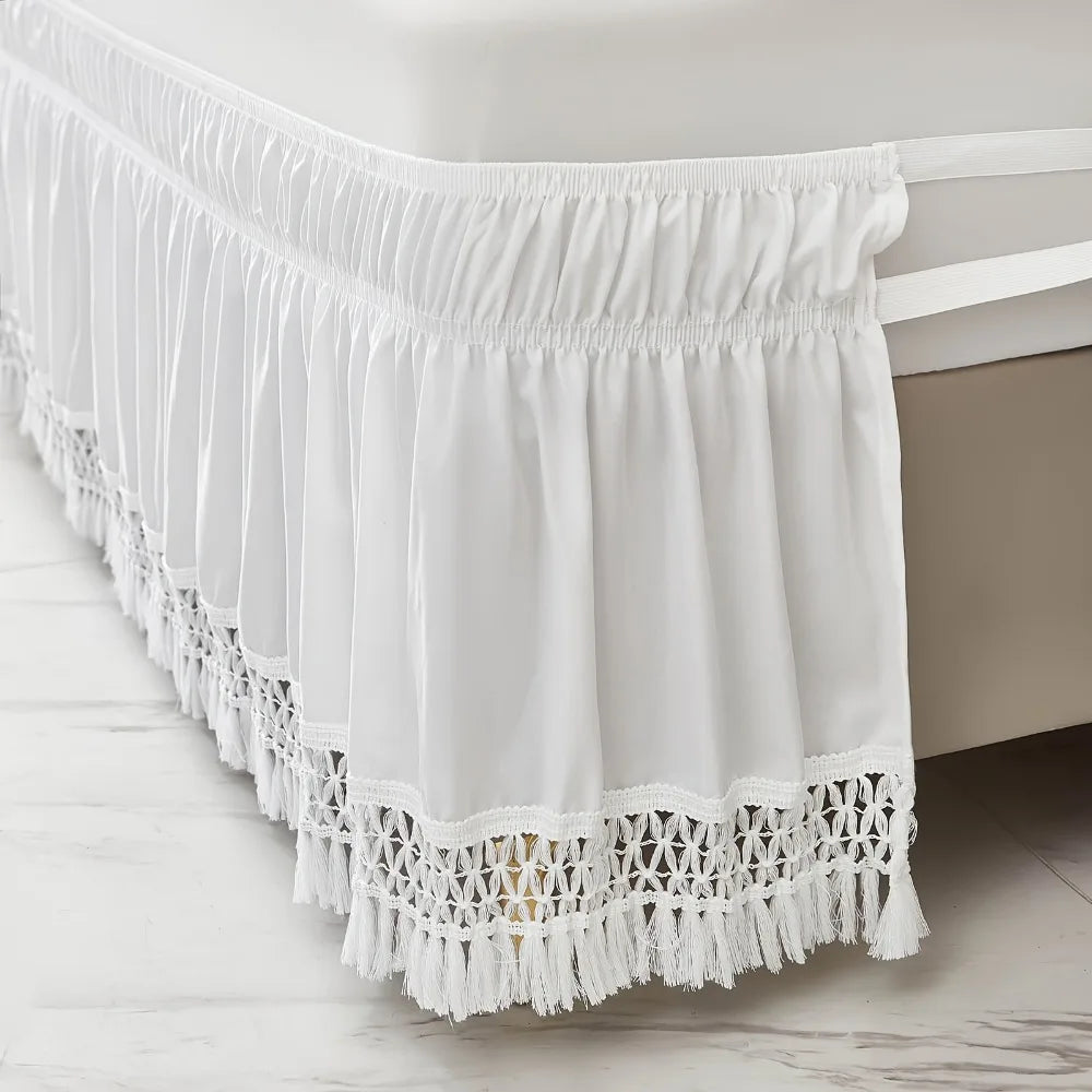 White elastic wrap-around bed skirt featuring ruffled fabric and lace trim