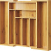 A wooden drawer organizer with multiple bamboo compartments for utensil storage.