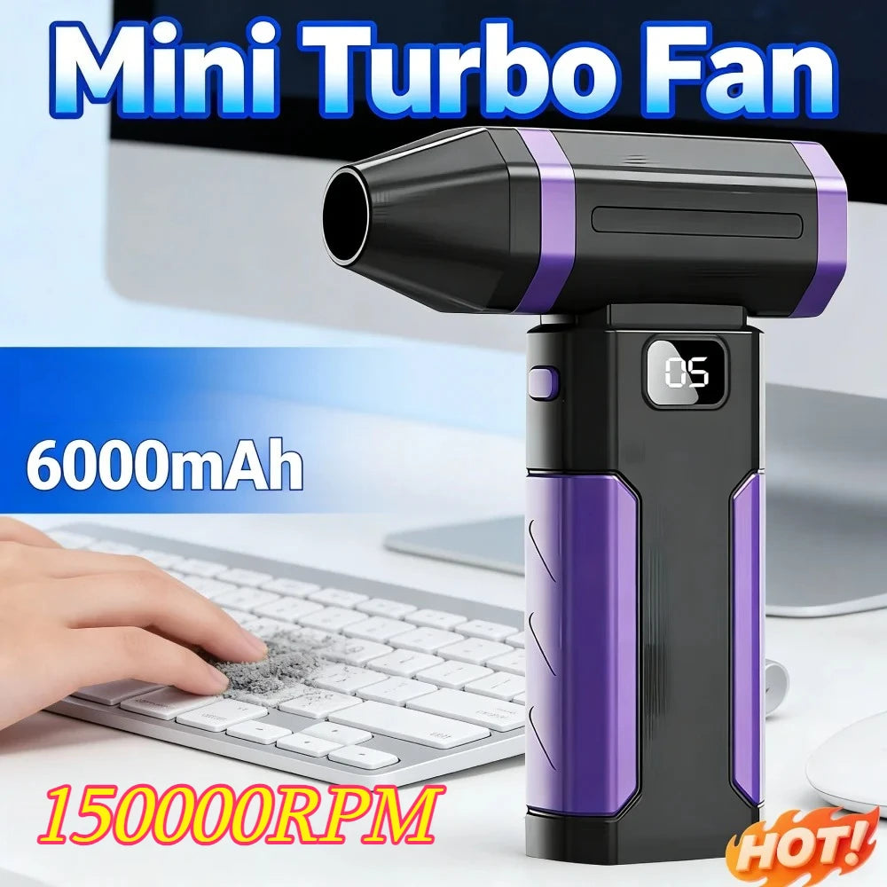 Schwarzer und violetter Mini-Turbo-Lüfter neben einer Laptop-Tastatur, mit 6000mAh Akku und 150.000 U/min Geschwindigkeit her
