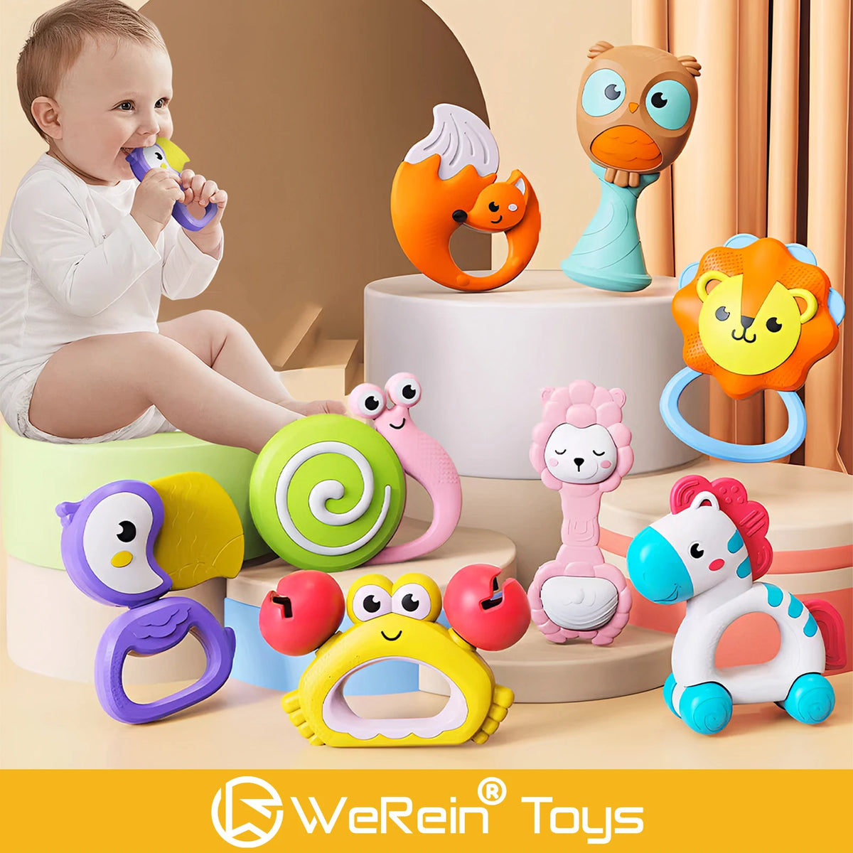A collection of colorful animal-themed baby rattle toys including a lion, owl, and giraffe, displayed on a light background.