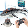 A person holds a remote control for a Mosasaurus water spray boat, with the toy dinosaur visible in the background.