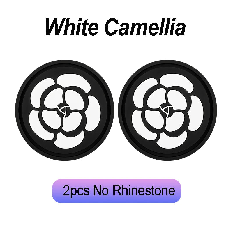 Black coasters featuring a white camellia paw pattern, suitable for car cup holders.