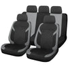 A set of black car seat covers featuring a honeycomb mesh pattern.