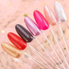 A set of clear acrylic false nail tips in various glitter and solid colors are displayed on thin wires.