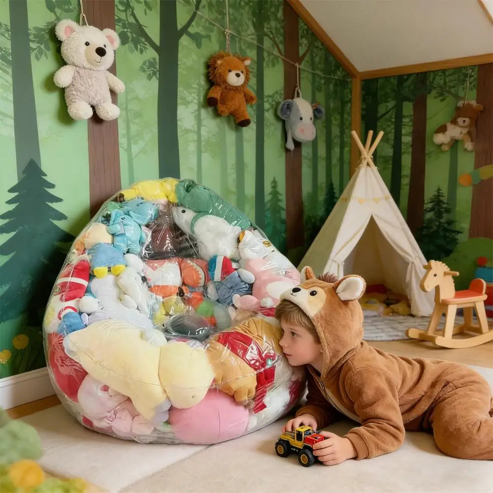 A child is sitting next to an inflatable plush toy storage bag filled with various stuffed animals in a room decorated with f