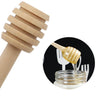 A wooden honey dipper stick is shown next to a close-up of golden honey dripping into a glass jar.