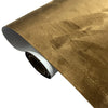 Roll of suede fabric in a golden brown color used for DIY interior and home decor projects.