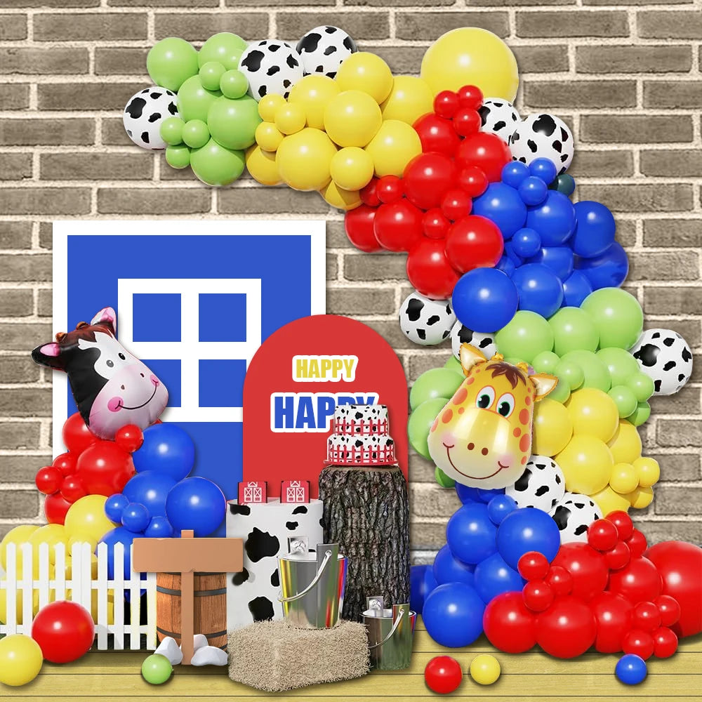 A colorful balloon arch kit featuring black and white cow print balloons in various colors like yellow, green, red, and blue.