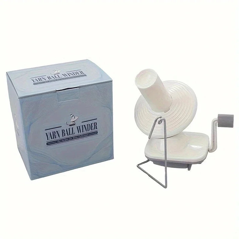 A box and a white hand-operated yarn ball winder device for knitting and crochet.
