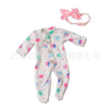 White long-sleeved jumpsuit outfit for a baby doll with pink floral patterns and a pink bow