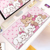 Pink kawaii cartoon illustration desk mat featuring fluffy white rabbits and pink bows