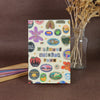 A colorful sticker book featuring fruit and letter designs for scrapbooking and journaling.