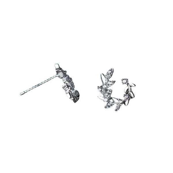 Sterling silver leaf stud earrings displayed against a white background.