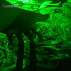 A dark silhouette of a hand is visible against a vibrant green laser light pattern.