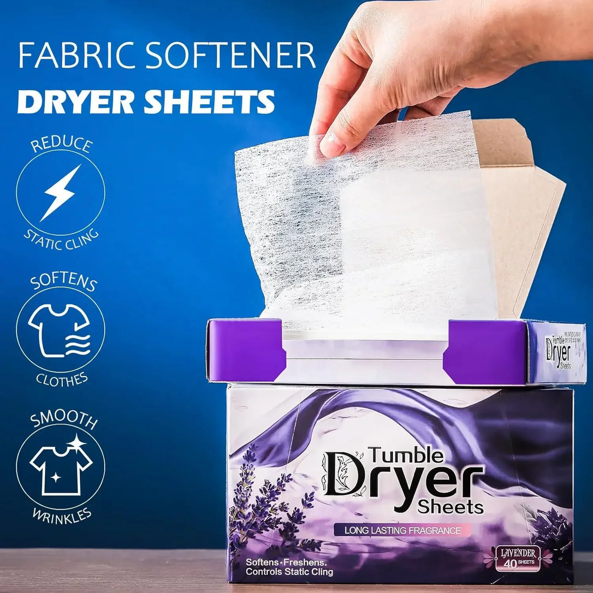 A hand is holding a box of purple and white fabric softener dryer sheets for reducing static cling and smoothing clothes.
