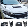 Black decorative hood scoop covers and air intake vents for a vehicle.