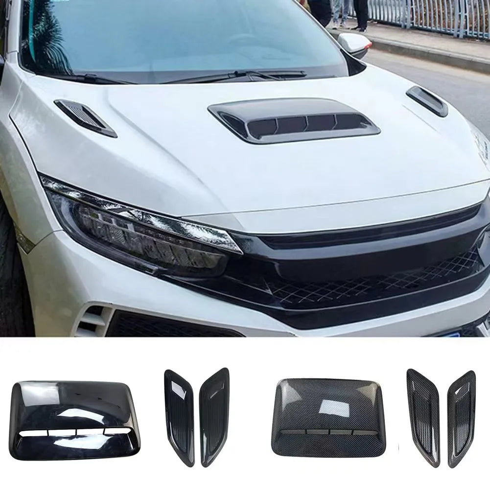 Black decorative hood scoop covers and air intake vents for a vehicle.