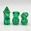 A set of seven translucent green acrylic polyhedral dice, including a tetrahedron and a dodecahedron.