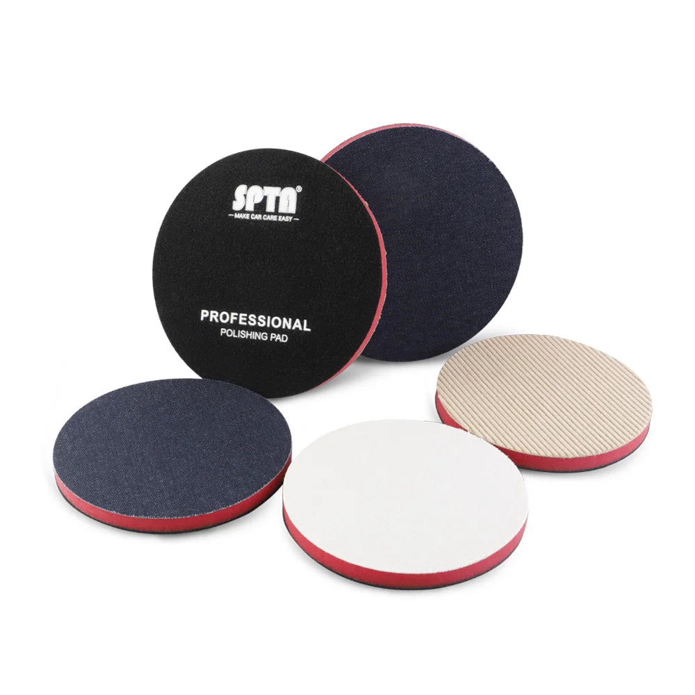 A set of black and tan polishing pads for automotive use, including a professional pad and a white pad.