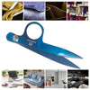 A blue precision titanium-coated tailor shears with a leather sheath shown alongside various fabric samples.