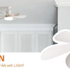 A white ceiling fan with a light fixture mounted on a white ceiling in a modern kitchen setting.