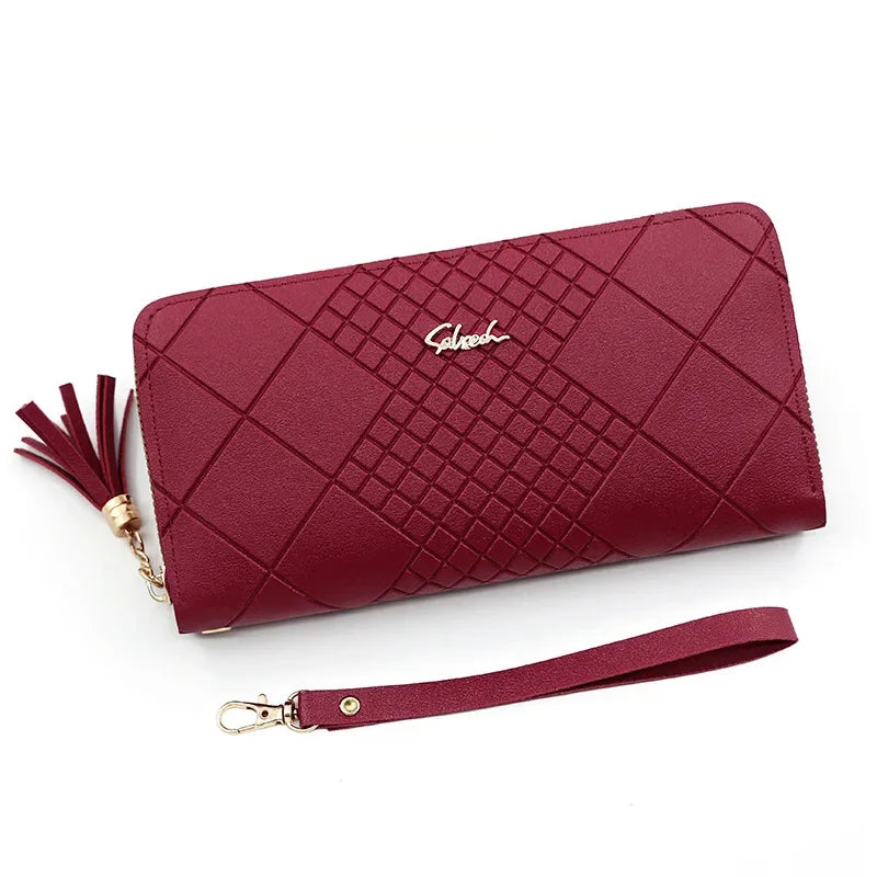 A deep burgundy quilted PU leather wristlet clutch wallet with a gold chain strap.