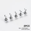 Five silver reusable nail glue clay pegs displayed on a clear acrylic shelf for fixing items.