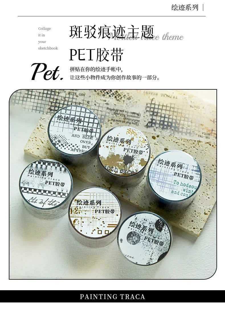 A collection of decorative PET washi tape featuring collage and textured designs in various shades of gray and white.