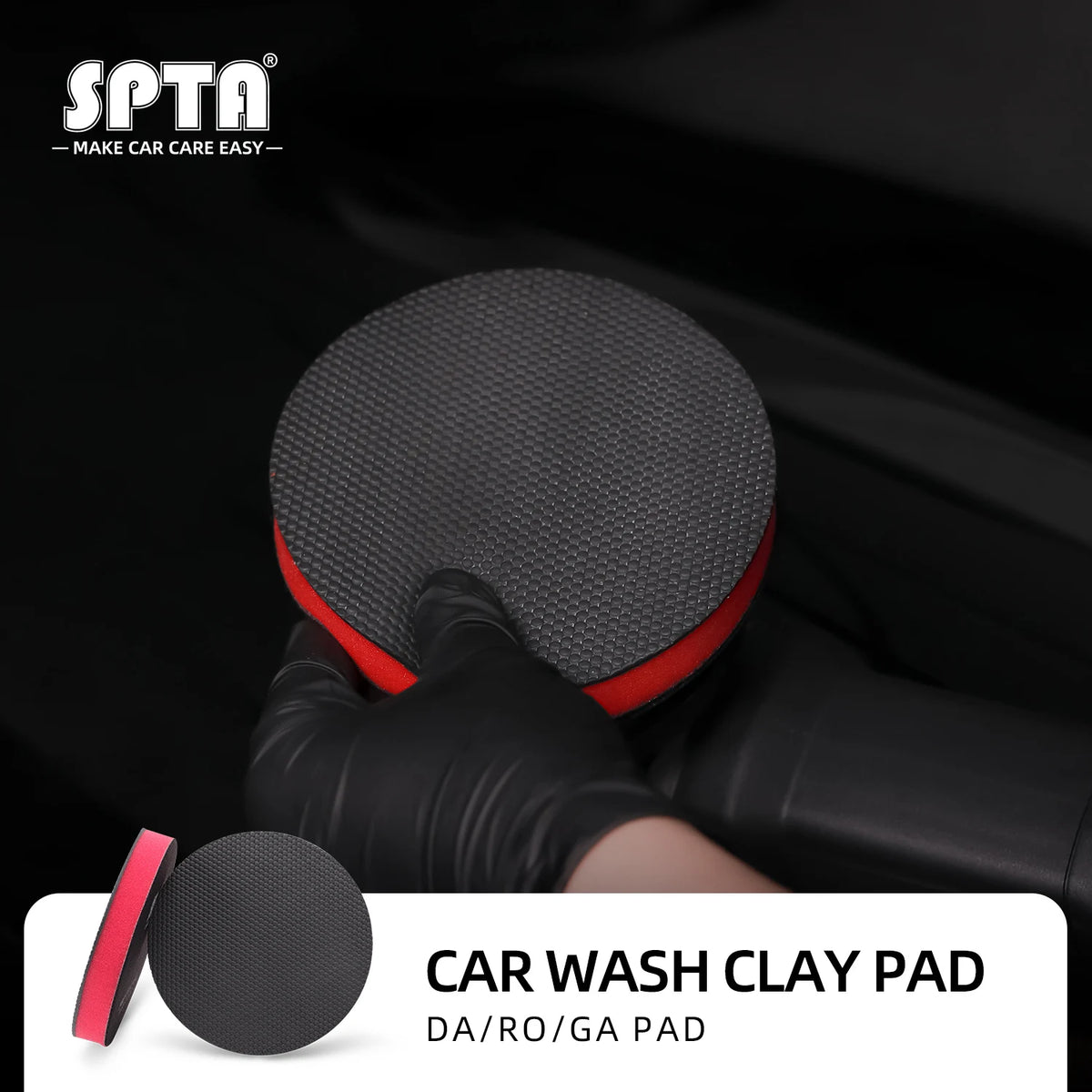 A hand wearing a black glove is holding a black clay pad for car wash paint detailing.